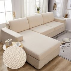 a living room with a sectional couch and coffee table on the floor in front of a window