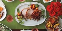 a table topped with lots of plates and bowls filled with different types of food on top of it