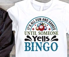 a t - shirt that says it's all fun and games until someone yes bingo