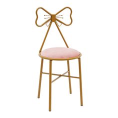 a gold metal chair with pink cushion and bow on the back, against a white background