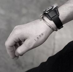 a person's wrist with the word hope tattooed on it, in black and white