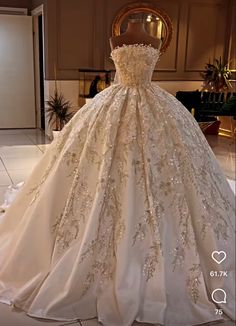 a wedding dress on display in a room