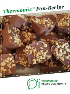 there are many pieces of chocolate with nuts on it and the words thermomiia fan - recipe