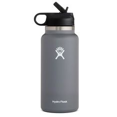 the hydro flask water bottle has a black lid and is grey with white logo