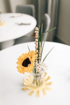 there is a vase with flowers on the table