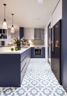 a kitchen with blue and white tile flooring