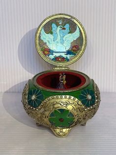 an ornately decorated box is sitting on a table