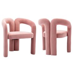 two pink chairs sitting next to each other