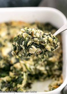 a spoon full of spinach and rice casserole