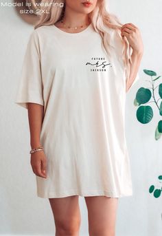 a woman with blonde hair wearing a white t - shirt that says bridesmaid