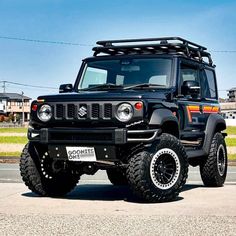 a black jeep is parked on the street