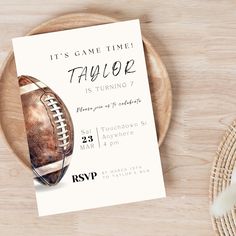 a football themed birthday party is set up on a wooden table with a plate and utensils