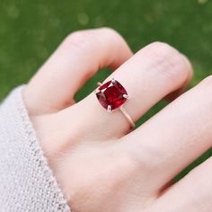 -------------------------------------------------------- Lab Ruby Ring - PLEASE NOTE: ALL RINGS WILL BE SIZED UP A BY A QUARTER DUE TO THE STONE'S FACETED POINT ON THE BOTTOM. THE PRODUCT - This is a gorgeous brilliant cut Ruby ring and is apx. 3 cts.  - Each ring is handmade by myself and is for the person who truly enjoys the look of a ruby and admires it's beauty in the lab created stone.   - We then polish them with a natural oil sealant for a beautiful shine.  - PLEASE NOTE THAT SOLID GOLD CAN TAKE UP TO 2-4 WEEKS TO BE MADE.  - PLEASE NOTE: JSL strives to match customer preferences for stone selection, but exact matches are not guaranteed. Please provide detailed preferences as we do not offer free stone exchanges. - FOR PEOPLE WITH IRON SENSITIVITIES, PLEASE BE AWARE THAT ALL WHITE Red Diamond Ring With Center Cushion Cut, Classic Red Birthstone Ring With Prong Setting, Red Classic Birthstone Ring With Prong Setting, Classic Red Birthstone Ring With Center Stone, Cushion Cut Ruby Ring For Formal Occasions, Formal Red Cushion Cut Ruby Ring, Lab-created Ruby Ring With Halo Setting For Promise, Ruby Solitaire Birthstone Ring In Round Cut, Cushion Cut Lab-created Ruby Ring In Red