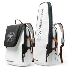 two white backpacks sitting side by side on top of each other with brown straps