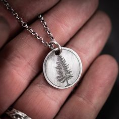 Unique Handmade Sterling Silver 925 pine Tree Necklace. The silver necklace was oxidized to create more antique rustic look. It is a unisex necklace so it fits both men and women. Wearing a tree necklace can be a way to express a connection with nature, a love for the outdoors, or a desire to symbolize personal growth and resilience. It's a versatile piece that can hold personal meaning and serve as a reminder of the beauty and strength found in the natural world. ~PERSONALIZATION~ I also offer Personalized Sterling Silver Nature-inspired Necklaces, Antique Silver Etched Necklace As Gift, Personalized Nature-inspired Sterling Silver Necklaces, Silver Engraved Nature-inspired Necklace, Silver Pendant Necklace For Outdoor, Silver Etched Nature-inspired Necklaces, Antique Silver Stamped Jewelry For Gift, Nature-inspired Sterling Silver Etched Jewelry, Nature-inspired Silver Etched Necklaces