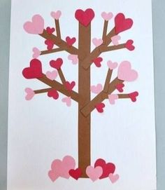 a paper cut out of a tree with hearts on it