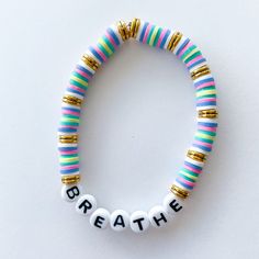 This bracelet is the perfect little reminder to breathe when life gets a little tricky! This bracelet is made with elastic string, clay beads, metal spacers, and plastic letter beads. Please measure your wrist before ordering. Note: the average size ordered is 7 inches.  Since all bracelets are custom made, I cannot accept and exchanges or returns. Bracelet Sayings, Reminder To Breathe, Heishi Bracelets, Heishi Bracelet, Making Bracelets With Beads, Beaded Jewelry Bracelets, Bracelet Inspo, Preppy Jewelry, Embroidery Bracelets