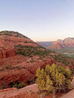 a scenic view of mountains and trees from the top of a mountain in sedona, arizona