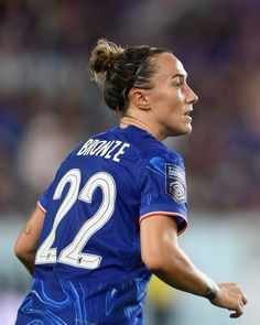 a female soccer player in action on the field