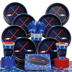 an assortment of sports themed plates and cups