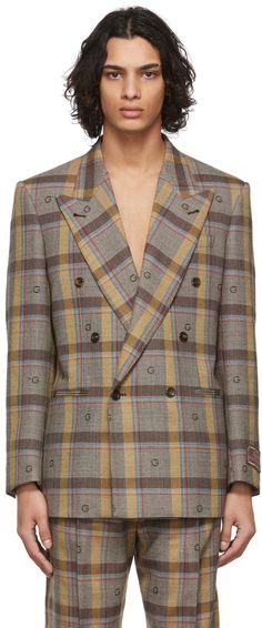 Long sleeve woven wool blazer in brown featuring check pattern in beige, blue, and red. · Monogram woven in brown throughout · Peaked lapel collar · Double-breasted closure at front · Welt pockets at waist · Five button surgeon's cuffs · Full satin lining Supplier color: Brown/Beige | Gucci Brown wool Check Blazer Gucci Notch Lapel Outerwear With Double Button, Gucci Elegant Double-breasted Blazer, Gucci Fitted Blazer With Double Button Closure, Gucci Fitted Double Button Blazer, Gucci Double-breasted Outerwear For Office, Gucci Elegant Blazer With Double Button Closure, Luxury Gucci Blazer With Double Button Closure, Classic Gucci Blazer With Double Button Closure, Gucci Double-breasted Office Outerwear