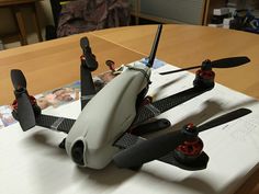 a remote controlled flying device sitting on top of a table