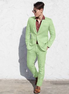 Give yourself a refined yet casual look that is extremely summer-friendly with our Solbiati Spring Green Linen suit. Crafted from pure linen, the green suit with its high quality and light eye-catching shade will give an upscale modern feel to your suiting wardrobe. Tag it with matching waistcoat, a white shirt, and brown shoes for a relaxed appearance. 
 
 Look Includes  Solbiati Spring Green Linen Fabric  Two Button Jacket Style  Notch Lapel  Faux Horn Beige Buttons  Single Vent  Three Cuff Bu Green Linen Suits With Notch Lapel, Elegant Green Linen Suits, Summer Linen Business Suits, Spring Green Formal Suit, Green Linen Suit, Green Linen Fabric, Herringbone Tweed Jacket, Grey Wool Suit, Tweed Pants