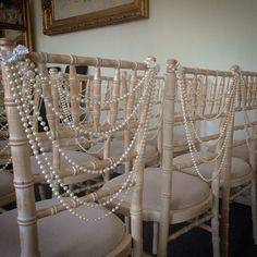 rows of chairs with pearls attached to them