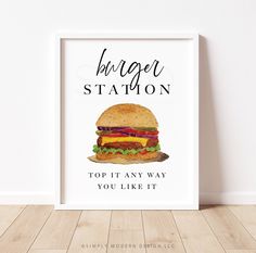 a white framed poster with the words burger station on it and a drawing of a cheeseburger