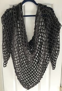 This new handmade crocheted shawl/wrap/scarf I have made is 100% acrylic, 4 ply yarn. It has an open lace, lattice pattern. It measures 84 inches at widest point. Length along spine, from neck to bottom point is 30 inches long. Side length from top to bottom point measures 52 inches. It is about 7 ounces. Please consider measurements and weight when ordering. It is a beautiful, rich, dark shade of gray. It is a gunmetal, slate gray.  A classic color. It will make a great gift because of its Crocheted Shawl, Crochet Wrap Pattern, 4 Ply Yarn, Scarf Yarn, Black Ombre, Crochet Wrap, Wrap Pattern, Lattice Pattern, Wrap Scarf