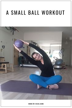 a woman sitting on a yoga mat with a ball in her hand and the words, a small ball workout