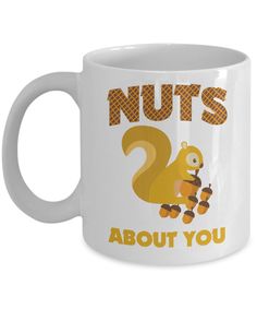 a white coffee mug with the words nuts about you and an image of a squirrel on it