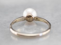 "This pearl solitaire ring will be a classic for years to come! The pearl shimmers to perfection, with a glowing ghostly white hue. Crafted from 18 karat white gold, this ring is refined beauty at its very best! Metal: 18K White Gold Gem: Pearl Gem Measurements: 6.6 mm, Round Ring Size: 5 Marks: \"18K\" Stamped on the inside band SKU #: LXWH095J Each piece has been identified and graded by a Graduate Gemologist who has been certified by the Gemological Institute of America (GIA). We have four br Yellow Gold Sapphire Ring, White Gold Solitaire, Gold Solitaire Ring, Dream Engagement, Round Rings, The Pearl, June Birth Stone, Ring Ring, Pearl Ring