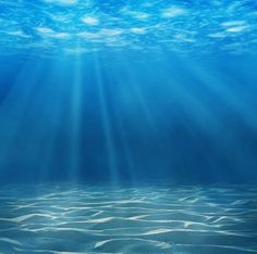 an underwater scene with blue water and sunbeams