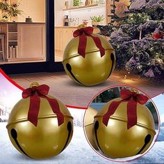 two christmas balls with red bows on them in front of a house and snow covered ground