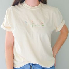 Spring Relaxed Fit T-shirt With Watercolor Print, Spring Casual T-shirt With Birth Flower, Casual Birth Flower T-shirt For Spring, White Watercolor Print T-shirt For Spring, Spring Birth Flower Crew Neck T-shirt, Spring Birth Flower Short Sleeve T-shirt, Relaxed Fit T-shirt With Watercolor Print For Spring, Botanical Style T-shirt With Floral Embroidery, Botanical Style Short Sleeve T-shirt With Floral Embroidery