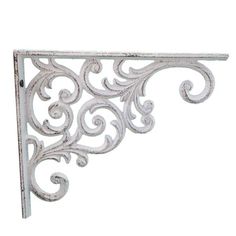 an ornate metal shelf bracket on a white background