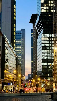 a city street filled with lots of tall buildings