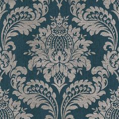 a blue and white wallpaper with an ornate design on it's side,