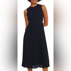 Stretch Crepe Fabrication A-Line Silhouette Crew Neckline Sleeveless Waist Seam Sunburst Pleated Skirt Midi Length Back Zipper Closure Approx. 48.75" Length Polyester/Spandex Machine Wash Cold/Dry Flat Imported. Navy Pleated Summer Dress, Navy Sleeveless Fitted Dress, Navy Fitted Sleeveless Dress, Chic Navy Sleeveless Midi Dress, Navy Sleeveless Dress For Work, Navy Sleeveless Midi Party Dress, Navy Sleeveless Midi Dress For Party, Pleated Skirt Midi, Skirt Midi