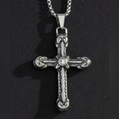 “Medieval Cross” Vintage Antique Ornate Elaborate Carved Leaflet Terminus Christian Catholic Crucifix Holy Devout Saintly Heavenly Pray Faith Jesus God Unisex Silver Stainless Steel Necklace. Medieval-Looking Cross With Carved Ornate Detailing. Each Limb Has Intentional Patterned Divots For A Weathered/Antique Look. The Center Has An “X” With A Smooth Silver Button Atop It. The Terminus Of Each Limb Have Nice Leaflets. On A Thick Rope Chain. Unisex Women Or Men. Stainless Steel. Anti-Tarnish! Hy Medieval Cross, Catholic Crucifix, Dragon Bracelet, Diamond Accent Ring, Thick Rope, Silver Button, Cz Stud Earrings, Mens Accessories Jewelry, Solid Gold Rings