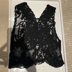 Good Condition Worn To Coachella Party Crochet Lace Top, Black Lace Top With Lace Work, Black Fitted Top With Lace Work, Fitted Black Tops With Lace Work, Sleeveless Crochet Lace Crop Top For Party, Fitted Black Top With Lace Work, Black Lace Top With Crochet Details, Elegant Black Crop Top With Lace Trim, Black Crochet Lace Top For Spring