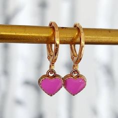 Enamel  Lilac Heart Earrings. Sweet little Heart Earrings to make you smile. 2 earrings. Treat yourself on Valentines Day  Modern classic small golden hoop huggie earrings.   Perfect valentines day gift. The earring open with a simple lever. Lightweight simple design, very easy to wear everyday, you won't even feel you're wearing any. Materials Hoops are high quality gold plate over brass with a stainless steel post.  Perfect for sensitive ears.  To keep your jewellery looking fabulous do not ge Pink Heart Charm Hoop Earrings For Valentine's Day, Pink Hoop Earrings With Heart Charm For Valentine's Day, Trendy Hypoallergenic Hoop Earrings For Valentine's Day, Pink Drop Huggie Earrings, Pink Heart-shaped Hoop Earrings For Gifts, Pink Heart Hoop Earrings As Gift, Pink Heart Hoop Earrings For Gift, Cute Dangle Hoop Earrings For Valentine's Day, Pink Heart Huggie Earrings For Pierced Ears