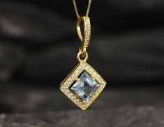 Gold Blue Topaz Pendant set with Natural Blue Topaz in a princess diamond cut, flawless clarity & yellow color, at 8x8mm, 3 Carats.Square Pendant design made of Gold Vermeil ☞ thickest 18k Gold Plating on top of Solid 925 Sterling Silver ☞ made to last.Free Gold Vermeil Chain with every Pendant order, 18 inch Silver chain (46 cm) ✓Matching Ring: www.etsy.com/uk/listing/868103249Matching Earrings: www.etsy.com/uk/listing/1047753659December Birthstone - Genuine & Natural Stones ❀⌛ Last Pen Aquamarine Jewelry With Diamond Accents For Gift, Sapphire Jewelry With Single Cut Diamonds For Gift, Sapphire Jewelry With Single Cut Diamonds As A Gift, Blue Princess Cut Jewelry With Diamond Accents, Gift Jewelry With Diamond Accents And Aquamarine, Gift Aquamarine Jewelry With Diamond Accents, Blue Topaz Jewelry With Diamond Accents For Gift, Sapphire Jewelry With Princess Cut For Gift, Fine Jewelry With Princess Cut Blue Topaz