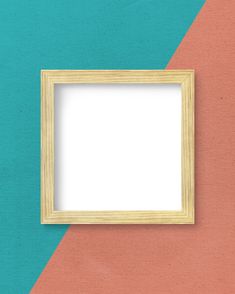 an empty wooden frame on a colorful wall