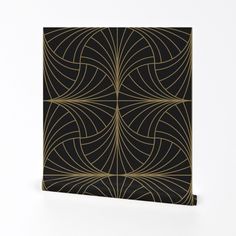 a black and gold wallpaper with an intricate design on the front, against a white background