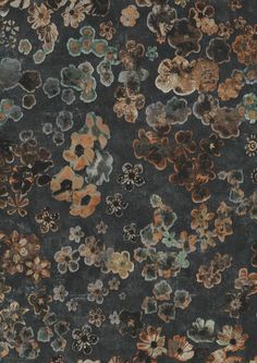 an area rug with many different colored flowers on it