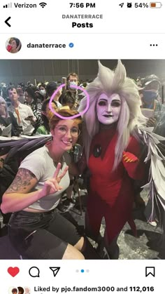 two people in costume posing for the camera