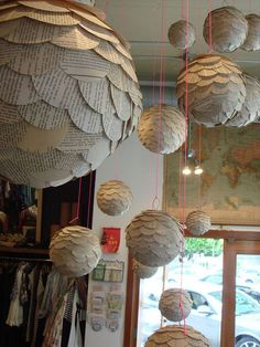 some paper balls hanging from the ceiling in a room