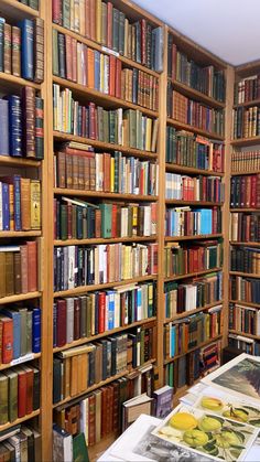 the bookshelves are full of many different colored books